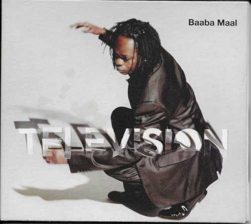 Allmusic album Review : On Television, Baaba Maal collaborates with Didi Gutman and Sabina Sciubba of New Yorks Brazilian Girls to fashion an album that combines subtle electronica with his own kind of Senegalese pop. The album took three years to record, and one track, the softly percolating dance tune "International," appeared the previous year on the Brazilian Girls CD New York City. The tune is club-friendly, with Maal delivering an unusually subdued vocal. The mix here is shorter and lacks the dub-like effects the Brazilian Girls dropped between verses on New York City. The album opens with the title track, a Maal/Brazilian Girls collaboration. A muted guitar figure that sounds like a music box floats below a funky samba-like beat. The African percussion embroiders the mix without overwhelming the bouncy club pulse. "Tindo" blends a drum loop, talking drum, and electric bass to propel the subtle intertwining vocals of Maal and Sciubba. "Miracle" sounds like South African jive. Long sustained electric guitar notes introduce this lilting, happy dance tune and Maal and Sciubba turn in a playful duet that skims across the glittering surface of the music. "Cantaloupe" was written by Maal, Gutman, and Barry Reynolds, the guitar player with the legendary Compass Point studio band. The melody has the Latin/Caribbean feel typical of American 30s movie musicals, while Maal contributes a traditional Senegalese vocal. A programmed rhythm track starts about midway through, to add a modern element to another laid-back track. Maal and Sciubba co-wrote "A Song for Women," a tune praising the power of African women, and its another surprisingly mellow effort. Maals vocals float in and out of the mix in a dub-like manner; hand percussion accents the songs drum loop without overwhelming its steady thrum. The album closes with two simmering acoustic tracks. "Dakar Moon," sung by Maal partially in English, has a vague Caribbean lilt that recalls the Cuban hotel music of the islands pre-revolutionary past. Sounds of nature -- the wind in palm trees, the shushing of the tide -- fill the background with Barry Reynolds adding some flamenco-flavored guitar. "Tindo Quando," another take on "Tindo," features Maals acoustic guitar and a subtle balafon supporting the vocals of Maal and Sciubba. Sciubba sings a counter-melody in Italian to complement Maals Fonyi vocal. Both singers hold back to show off the softer, melodic side of their vocal prowess.