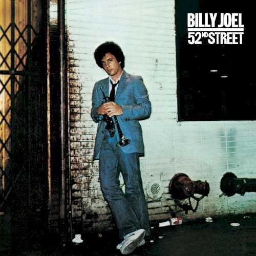 Allmusic album Review : Once The Stranger became a hit, Billy Joel quickly re-entered the studio with producer Phil Ramone to record the follow-up, 52nd Street. Instead of breaking from the sound of The Stranger, Joel chose to expand it, making it more sophisticated and somewhat jazzy. Often, his moves sounded as if they were responses to Steely Dan -- indeed, his phrasing and melody for "Zanzibar" is a direct homage to Donald Fagen circa The Royal Scam, and it also boasts a solo from jazz great Freddie Hubbard à la Steely Dan -- but since Joel is a working-class populist, not an elitist college boy, he never shies away from big gestures and melodies. Consequently, 52nd Street unintentionally embellishes the Broadway overtones of its predecessor, not only on a centerpiece like "Stiletto," but when hes rocking out on "Big Shot." That isnt necessarily bad, since Joels strong suit turns out to be showmanship -- he dazzles with his melodic skills and his enthusiastic performances. He also knows how to make a record. Song for song, 52nd Street might not be as strong as The Stranger, but there are no weak songs -- indeed, "Honesty," "My Life," "Until the Night," and the three mentioned above are among his best -- and they all flow together smoothly, thanks to Ramones seamless production and Joels melodic craftsmanship. Its remarkable to think that in a matter of three records, Joel had hit upon a workable, marketable formula -- one that not only made him one of the biggest-selling artists of his era, but one of the most enjoyable mainstream hitmakers. 52nd Street is a testament to that achievement.