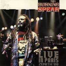 Allmusic album Review : Winston Rodneys (aka Burning Spear) first live waxing remains as righteous a live reggae disc youre ever gonna feast upon. Well, this recent live double shot is hardly its predecessors equal, but Rodney is still one of the truly great voices in reggae. So even when the going gets rough, or boring, or meanders into Jah oblivion, hes still worth the price of admission. His new band (complete with all-female horn section) is a tightly skanking bunch of bohunks who negotiate the labyrinthine rhythmic pulsation with grace and panache. And while the material here is no match for earlier stuff like "Marcus Garvey," "Slavery Days" and "Man in the Hills," it stacks up well by comparison, especially "Spear Burning" and "Creation Rebel."