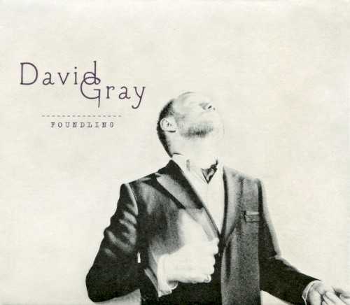 Allmusic album Review : Written during the same sessions that spawned 2009’s Draw the Line, Foundling is another pleasant, pastoral effort from David Gray, who seems to have settled into a contemporary folk mold after flirting with electronics during the ‘90s. “Only the Wine,” which kicks off this two-disc set with acoustic guitar and brushed percussion, takes its cues from Van Morrison and Nick Drake, both of whom serve as stylistic touchstones throughout the album. Gray plays to his strengths fairly well, keeping the tempos leisurely and the mood relaxed, and he looks to his arrangements for diversity, either paring a song down to its piano-and-vocals skeleton or dressing it up in light layers of strings, organ, and electric guitar. When he does throw a curve ball into the mix, it’s a nice change -- the slow-building title track stretches a Celtic soul groove over five and a half minutes, and “Morning Theme” (one of the eight tracks that make up the bonus disc) sets itself up as a piano lullaby, with fingerplucked guitar arpeggios and gauzy, cooing harmonies rounding out the song. Those moments are few and far between, but David Gray doesn’t really purport to be anything other than a contemporary folk-pop singer, and Foundling finds him doing what he does best.