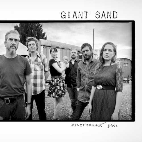 Allmusic album Review : Giant Sand isnt really a band these days; instead, its a concept that has emerged from the mind of Howe Gelb, and ultimately, thats all for the best. Its hard to imagine how Gelb could get one reasonably sized set of musicians to conjure up the many moods and tonal colors of Giant Sands 2015 studio effort Heartbreak Pass, but by jumping back and forth between several states, countries, and continents, hes not only come up with an uncommonly rich and imaginative set of performances, hes made an album that scans remarkably well considering the miles he logged putting it together. One tune, "Done," was cut during sessions in Brussels, Crete, and Ottawa, while "Heaventually" features bits recorded in Italy, England, Tennessee, and Arizona. As Gelb says in the liner notes, Heartbreak Pass comprises "3 volumes of 15 songs here representing living 2 lives for 30 years. Dont do the math. It doesnt figure." And hes right, it doesnt, but if the numbers are faulty, the emotions are not, and all that globetrotting does serve a thematic purpose. One of the key recurring themes on Heartbreak Pass is the nomadic life of a musician, and how hard it is to hold on to the people you love when youre hopping on planes, battling jet lag, or simply trying to remember where you are. One of the albums most touching songs, "Home Sweet Home," deals with the nuts and bolts of a touring artists routine, and the closer is, significantly enough, a rough but sweet duet between Gelb and his teenage daughter, "Forever and Always." This being Giant Sand, Gelbs longing and weariness are filtered through his smoky, warmly downbeat vocals and an arid melodic style that fuses the C&W; melodies with enough left turns and electronic seasoning to remind us were not in Tucson anymore, at least most of the time. But Gelbs songs are always heartfelt behind his occasional eccentricities, his musicians (who include Jason Lytle of Grandaddy, former Sonic Youth drummer Steve Shelley, Grant-Lee Phillips, and Ilse DeLange) do splendid work on Gelbs behalf, and John Parishs production smarts hold the album together gracefully. Heartbreak Pass is, like much of Howe Gelbs best work, an ambitious project that still seems emotionally intimate, and revels in a ramshackle charm that belies how strong the elements truly are -- its one mans unique vision, and if hes proud of it, well, he certainly should be.