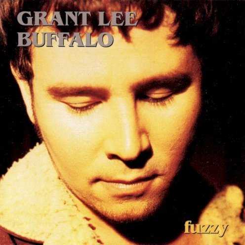 Allmusic album Review : When Grant Lee Buffalo cut their debut album, 1993s Fuzzy, they had a distinct advantage over most bands making their first trip to the studio -- vocalist and guitarist Grant Lee Phillips, bassist Paul Kimble and drummer Joey Peters had already recorded two LPs together as members of the then-recently defunct Shiva Burlesque, and most of Fuzzys 11 songs dated back to SBs latter days. This goes a long way towards explaining how Grant Lee Buffalo were able to make an album as confident and solidly crafted as Fuzzy, but it was even more significant that Phillips had a marvelous voice, wrote fine and evocative songs, and was fortunate enough to be working with sympathetic accompanists who had a good idea of how to tap into the mysterious melodic structures of his music. (Kimble was an especially valuable ally in the studio, helping to produce and engineer these recordings and giving this album its full, widescreen sound.) Fuzzy is Grant Lee Buffalos most satisfying album; while the group would expand on their musical formula over their next three albums, this albums relative simplicity and striking dynamics ultimately serve these songs better than the more elaborate recordings that would follow, and tunes like "Soft Wolf Tread," "Dixie Drug Store" and the title cut fuse the richly American imagery of the burgeoning alt country movement with a California gothic sensibility that was all their own. Fuzzy is deep and mysterious stuff, but also very beautiful and crafted with imagination and care, and its no wonder Grant Lee Buffalo became critics darlings shortly after this was released.