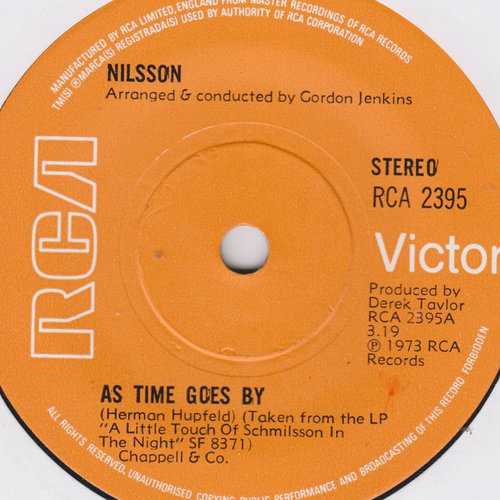 Allmusic album Review : Harry Nilsson was always a maverick artist, following his own sense of style down the hallways of pop, turning out carefully crafted -- even baffling -- songs that shared no direct affinity with any other artist of his day, although in some ways he resembled Randy Newman (even recording a marvelous album of Newman covers). Both men drew on American Tin Pan Alley traditions, but while Newman used them to craft his own ironic view of the little cruelties and kindnesses of the human condition, there was a part of Nilsson that always wanted to actually be a part of that tradition, making him, in some ways, a singer stuck out of time. In 1973 he released A Little Touch of Schmilsson in the Night, an album of pop standards from the pre-rock era done with the arranging and conducting help of Gordon Jenkins, who had worked in a similar role with such musicians as Frank Sinatra, Nat King Cole, Benny Goodman, and Louis Armstrong. The album was not particularly well received by Nilssons rock fans, and when a sort of sequel, A Touch More Schmilsson in the Night, was released in 1988, hardly anyone noticed. As Time Goes By combines both albums into one strong sequence, and it affords a chance to take another look at this phase of Nilssons career. Always a fine song interpreter (his version of the Badfinger song "Without You" stands as the definitive one, for instance, as does his rendition of Fred Neils "Everybodys Talkin"), Nilssons lyrical phrasing on such standards here as the title tune, "As Time Goes By," and Gus Kahn and Walter Donaldsons "Makin Whoopee" is nothing short of astounding, redefining and breathing life into them for a new era. Always a master of the hushed nuance, the gentle dignity and sincerity of Nilssons singing stands at the very heart of this album. Jenkins full orchestra arrangements dont intrude, but augment and support the delicate twists and turns of Nilssons phrasing, making this a wonderfully realized romantic album (in the best sense of the word). Having both albums together like this actually makes for a stronger presentation of these timeless songs, and while fans of Nilssons rockier side may well be disappointed by As Time Goes By, it is, in some ways, a more revealing release than any other in his canon.