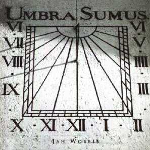 Allmusic album Review : The strange, spiritual album that is Umbra Sumus is one of the more interesting items released in 1998. Bassist and composer Jah Wobble creates strangely compelling soundscapes that draw textures from a variety of ethnic traditions without explicitly evoking any one of them. The first cut, "Il Jevedro il Oblanco," sets the pace with a duet for what sounds like a toy music box and fuzz bass, but suddenly becomes a lush electronica-pop track as vocalist Amila Sulejmanovic begins singing in Bosnian. Elsewhere, Natacha Atlas croons in Arabic over a texture not of ouds and doumbeks, but of synthesized percussion, keyboards, and Wobbles own throbbing bass, and it sounds perfectly natural. "I Offer You Everything" blends reggae percussion, piano, and B.J. Coles wonderful pedal steel guitar to create something that should have been a crossover pop hit. At times, Jah Wobbles music verges on art-jazz, at times electronica with melodic sound effects, and at times it is in territory that doesnt have a name because nobody else sounds quite like this. Whatever you call this music, it is interesting throughout. Though styles shift continuously, there isnt a dud track on Umbra Sumus, and its a must-have for those who like intelligent and highly textured pop. The name of this album translates as "We Are Shadows," but many listeners will find that this music sheds welcome light on the possibilities of musical fusion.