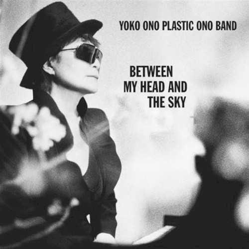 Allmusic album Review : Shes really back; one of the most gloriously influential and notorious women in the history of rock has returned with a new album at the age of 76, and thank goodness. With Between My Head and the Sky, Yoko Ono has courageously and outrageously revived the Plastic Ono Band moniker; a group she and husband John Lennon formed together; only this time, instead of the late John, its with the couples son Sean Lennon. Audacious? Oh yeah, but wait until you hear it! On 2007s Yes, Im a Witch, Ono gave a bunch of her old tracks to artists like J. Spaceman, Chan Marshall, DJ Spooky, and the Flaming Lips, to name a few, and re-recorded them. This time out, she surrounded herself with New York studio players, Seans own band, and guests such as Yuka Honda from Cibo Matto, and members of Cornelius. The end result is a stunning collection of 16 wildly diverse tracks that were written in six days and recorded very quickly. The centerpiece is an electronic-cum-acid rock spoken word peace called "The Sun Is Down," with screaming guitars, crisscrossing beats and breaks, and Honda offering sung vocal support drifting entrancingly in the backdrop. Then there is the funkier material, such as the wonderfully surreal "Ask the Elephant," with some stellar feedback and heavy guitar work by Sean, and the overtly rockist title track, where Ono speaks more emphatically than she has in decades. This isnt just rock as spoken word, its got groove, crunch, noise, and vulnerability as well as authority, and in places, yes, her trademark ululating wail. "Watching the Rain" is a midtempo ballad with shimmering blips and beats, her singing voice is expressive in its limited range, and her words are deeply moving. The shamanistic, trance-like quality of "Moving Mountains" melds acid folk and new production styles with a beautiful layer of horns -- trumpets mainly -- in the background. Come to think of it, there are a lot of trumpets on this record. Ultimately, however, Between My Head and the Sky is perhaps the most accessible album shes recorded, and yet the most forward looking, too, because it is ultimately contemporary in that it takes the past into account while pushing its margins to the breaking point and pointing to the known -- check the jazzed-up funky reggae in "Hashire, Hashire." This set is not full of ballads; there is little of the fragility of Walking on Thin Ice here, though its desire to heal individuals and the world is ever present, and has none of the overt self-conscious excesses of Plastic Ono Band projects of the past. This is a deeply focused, wonderfully colorful, and deeply expressive work that showcases a collaboration between mother and son and displays depth, strength, creativity in spades, and intense beauty.