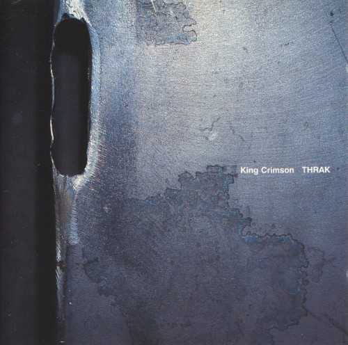 Allmusic album Review : The only progressive rock band from the 60s to be making new, vital, progressive music in the 90s, King Crimson returned from a ten-year exile in 1995 with THRAK, their first album since 1984s Three of a Perfect Pair. As with the 80s band, guitarist/ringleader Robert Fripp recruited singer/guitarist Adrian Belew, bassist Tony Levin, and drummer Bill Bruford for this incarnation of his classic band. However, he added to this familiar quartet two new members: Chapman Stick player Trey Gunn and ex-Mr. Mister drummer Pat Mastelotto. Effectively, Fripp created a "double trio," and the six musicians combine their instruments in extremely unique ways. The mix is very dense, overpoweringly so at times, but careful listens will reveal that each musician has his own place in each song; the denseness of the sound is by design, not the accidental result of too many cooks in the kitchen. Sometimes, as in "THRAK," the two trios are set against each other, in some sort of musical faux combat. In others, they just combine their respective sounds to massive effect. On "Dinosaur," perhaps the strongest track on the record, Mastelotto and Bruford set up an ominous tom-tom groove that supports an even more ominous guitar figure. The vocal, the musings of a long-dead sauropod, are vintage Belew, just as the freaky, falling-down-the-stairs solo in the middle is vintage Fripp. Other high points include the drum duet "BBoom" and the two Belew/Fripp "Inner Garden" pieces. Allusions to earlier Crimson abounds, such as the form of "VROOM," for example, which is suspiciously reminiscent of "Red" (from the 1974 album of the same name), or the shout-out to "The Sheltering Sky" (from 1981s Discipline) in "Walking on Air." Thankfully, this never gets annoying, but instead acts as a subtle nudge and a wink to faithful fans. King Crimson came back in a major way with THRAK, and proved that, even in its fourth major incarnation, Fripp and company still had something to say. High-quality prog.