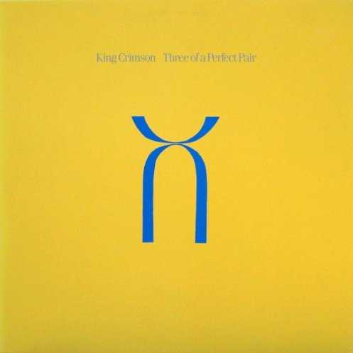 Allmusic album Review : Upon its release in 1984, Three of a Perfect Pair caused some unrest among fans of King Crimson. Most of their audience felt that the band had made a conscious and obvious decision to try to break through to a more mainstream pop audience. But in hindsight, this is hardly the case; it sounds unlike anything that was out at the time. Like 1982s Beat, Three of a Perfect Pair doesnt quite meet the high standards set by 1981s Discipline, but does contain a few Crimson treats. The opening title track has an unrelenting groove that never seems to let up, while "Sleepless" starts off with Tony Levin laying down some funky bass until Adrian Belews trademark paranoid vocals kick in and assure the listener that "its alright to feel a little fear." Also included are the seven-minute instrumental soundscape "Industry," and the cautionary tale of a "Model Man." This would prove to be the new King Crimsons last release for nearly ten years; the group disbanded soon after as its members concentrated on solo careers and other projects, until a mid-90s reunion brought them all back together.