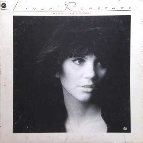 Allmusic album Review : Following the same formula as her early records, Heart Like a Wheel doesnt appear to be a great breakthrough on the surface. However, Ronstadt comes into her own on this mix of oldies and contemporary classics. Backed by a fleet of Los Angeles musicians, Ronstadt sings with vigor and passion, helping bring the music alive. But what really makes Heart Like a Wheel a breakthrough is the inventive arrangements that producer Peter Asher, Ronstadt, and the studio musicians have developed. Finding the right note for each song -- whether its the soulful reworking of "When Will I Be Loved," the hit "Youre No Good," or the laid-back folk-rock of "Willing" -- the musicians help turn Heart Like a Wheel into a veritable catalog of Californian soft rock, and it stands as a landmark of 70s mainstream pop/rock.