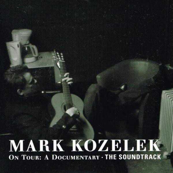 Allmusic album Review : When Mark Kozeleks Caldo Verde label released the documentary DVD On Tour in 2011, many fans wished for a standalone soundtrack to the simply yet elegantly shot black-and-white film. They got their wish. Recorded on his European and North American tours in 2010 and 2011, which took place in churches, hotels, clubs, and concert halls, these performances all feature the singer and songwriter accompanied only by a nylon-string guitar. These are the full versions of all the songs in the documentary, plus four bonus tracks that bring the sum total to 33. Beautifully recorded, the material is centered on Kozeleks recordings with Sun Kil Moon. That said, among the bonus cuts are gorgeous versions of "Take Me Out," "Mistress," and "Things Mean a Lot" off the self-titled Red House Painters debut recording, and "Cruiser" from the bands Old Ramon effort. Other highlights include lovely versions of "Blue Orchids," "Moorestown," and "Lucky Man," all of which originally appeared on 2008s SKM album April; an acoustic cover of Modest Mouses "Four Fingered Fisherman" (its studio version appeared on Tiny Cities -- an entire SKM album devoted to MM covers), "Carry Me Ohio," and "Heron Blue." While its reasonable think this is for fans only, On Tour actually provides a very solid introduction to Kozelek as a songwriter. His melancholic view of the world is well and abundantly articulated here, but it is in that view that he finds beauty. In this intimate setting, he imparts it gently and tenderly to the listener.