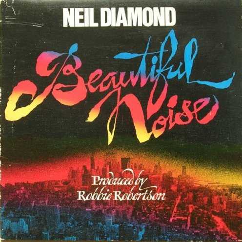 Allmusic album Review : Beautiful Noise, Neil Diamonds 11th studio album in the ten years since he emerged with his first chart single "Solitary Man," announces its ambitions on its cover, which displays the skyline of Manhattan under a red horizon and a black sky, overlaid with the words "Produced by Robbie Robertson." Most albums, of course, do not announce the name of the producer on the front cover, but Diamond wants to let people know that Beautiful Noise is an event. That he had convinced his Malibu, California, neighbor, the Bands guitarist and songwriter, to produce him was a surprise not only because he had worked with longtime producer Tom Catalano off and on dating back to his first solo singles session in 1963, but also because Robertson possesses the kind of rock credentials Diamond had never been granted. Further, as that ominous cover and Diamonds record sleeve epitaph ("...tin pan alley died hard, but there was always the music to keep you going") indicate, Beautiful Noise was intended as something of a concept album, the songwriters look back at his days as a scuffling denizen of the Brill Building in the early 60s. This theme comes out immediately in the rousing title song, in which he sings of the inspiration that the citys sounds bring to him. Thereafter, the story line seems to get lost, at least in lyrical terms, but Diamond and Robertson give each track its own musical identity: "Stargazer" employs a Dixieland arrangement, complete with wailing horns; "Lady-Oh" is the discs romantic ballad; "Dont Think … Feel" has a Caribbean rhythm; "Surviving the Life" is in gospel style; "Street Life" has a jazz/R&B; feel with a vocalese melody; "Home Is a Wounded Heart" is the torch song; and "Jungletime" is the rock & roll number. The heart of the album (and its leadoff single) is "If You Know What I Mean," in which Diamond looks back with regret and a sense of loss on his youth, "when we gave it away for the sake of a dream/In a penny arcade, if you know what I mean." What he seems to mean, among other things, is that his idealism was betrayed by greedy people, perhaps not a surprising sentiment for a man who, as this album was made, was still in litigation over his early recording and publishing contracts. With Robertsons help (and that of a lot of other musicians), Beautiful Noise is certainly the best-sounding and most consistently engaging album of Diamonds career up to 1976.