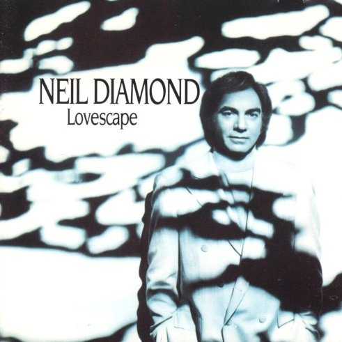 Allmusic album Review : Lovescape frames Neil Diamonds typically strong, if a little over-dramatic, vocal style with plinking keyboards, cooing backup singers, and hissing, breathy synthesizers. Its all drenched in the kind of reverb that screams "lite rock radio sap." Fortunately, Diamonds wine-stained voice is still full of emotion and more than capable of closing the albums gaping holes with a just-right emphasis here and a plaintive growl there. "Mountains of Love"s sanitized world beat groove and keening horns would shrivel in anyone elses hands. But when Neil sings "Come on lets go/Weve got room on that mountain of love," you want to believe in his feed-the-world message and follow him right to the top of the peak (how does he climb in those ankle boots?). A strummed acoustic guitar slows down the Hammond/Warren composition "Dont Turn Around," letting it breathe like the classic "Red Red Wine" -- Diamonds take has none of the mechanization of Ace of Bases later hit version. He has written or co-written 11 of Lovescapes 15 tracks, and its his lilting, bruised heart duet with Kim Carnes thats the obvious standout. Elsewhere, he covers "One Hand, One Heart" from West Side Story, refueling the ballad with his typical message of unification and peace, and buoys the faint country feel of "When You Miss Your Love" with a deft vocal touch, never letting it drift into dangerous Elton John territory. Although heaping helpings of synthesizer do their worst to slow him down, Diamond does his best with Lovescapes material, and salvages a handful of memorable moments for longtime listeners or the casual fan.