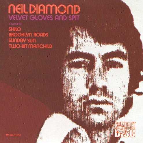 Allmusic album Review : Neil Diamonds debut LP for Uni Records and his earliest extant album, Velvet Gloves and Spit has appeared in two distinctly different versions. Originally issued in October of 1968 as a ten-song LP with a photograph of Diamond in close-up on the cover, it attracted relatively little attention despite some excellent songs and one bold (if heavy-handed and misguided) effort at serious, topical songwriting. That album never sold well -- none of Diamonds albums did in those days -- and two years later, in October of 1970, it was re-released with a new cover, featuring an artists rendition of Diamond, and an 11th song -- Diamonds version of "Shilo," which hed previously recorded for Bang Records -- added to it. Apart from "Shilo," most of the record was cut in New York (as opposed to the smoother, more subtly soulful, elegant sounding Memphis-based recordings that would follow) and a lot of Velvet Gloves and Spit sounds closer in texture to "Cherry Cherry" and the other sides cut by Diamond during his Brill Building phase at Bang Records through 1967, than to "Sweet Caroline" and the other records with which Diamond closed out the 60s. There are some fine songs here, including "Honey Dripping Time," "Practically Newborn," "Holiday Inn Blues," and "Sunday Sun," and "Two-Bit Manchild" is a fascinating adaptation of his Brill Building-era sound to a personal/introspective lyric and approach (imagine the Monkees sound melded to a singer/songwriter persona). To appreciate this album, however, one must get past "The Pot Smokers Song," a heavy-handed, anti-drug, bubblegum pop number, patterned roughly after Simon & Garfunkels "Old Friends/Bookends," with trippy spoken word testimonials about the dangers of drugs (including one addict who claims to shoot heroin into his spine), punctuated by Diamonds ridiculous sing-song chorus ("Pot, pot/Gimme some pot/Forget who you are/You can be who youre not"). Its a strangely fascinating artifact and helps distinguish Velvet Gloves and Spit from Diamonds catalog of uneven albums. Also present is "Shilo," recorded at Chips Momans American Studios in Memphis, which jumps ahead, presenting Diamond in his next stylistic phase with the sound that would carry him into the 70s.