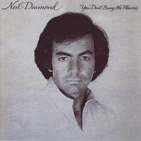 Allmusic album Review : Neil Diamond -- the voice, the artist, the entertainer -- is best described through this record as a rhapsody of American pop culture during this period in the late 70s. Directly and appropriately, Diamond sings with sincerity that "the American popular song goes on." Perhaps this record best demonstrates a mission statement of creating an endearing work of music that all Americans can feel happy and satisfied with. Much of the material is uplifting, both in tempo and lyrical expression. Other songs are emotionally gripping and romantically involved. The work as a whole seems to be vintage Diamond, and does not stand out from any of his other records as unique. However, there is one duet that breaks the mold: his passionate showing with Barbra Streisand on the cover song, "You Dont Bring Me Flowers," a slow, powerful, and troubling ballad for those drifting out of relationships. "Forever in Blue Jeans" is the anthem that caught on with easy pop listeners in the late 70s, and continues to be a staple song for Diamond. "Remember Me" is a gentle song of longing and memories concerning past friendships, past loves, and places traveled. The typical Diamond sound is expressed here to perfection, with the vocals of Diamond backed by a stirring and articulate orchestra. The record doesnt dive into any deep ocean of creativity, nor does it strive to meet jazzier expectations. The arrangements and the songwriting are written just well enough to appeal to the easy listening audience, and the marching percussions of Diamonds songs fit the grade. Such a well-performed song of percussion and charging tempo is the cover, "Youve Got Your Troubles." Sung with passion and grace, this is Neil Diamond during his peak, and merits a listen for all late-70s enthusiasts.