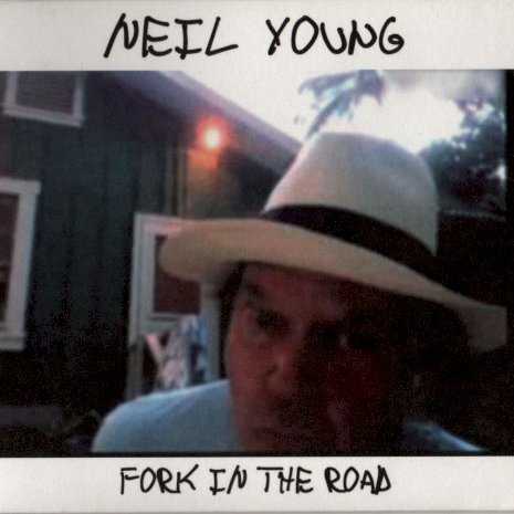 Allmusic album Review : It somehow is fitting that Fork in the Road arrived in stores a week after President Barack Obama announced his bail-out plan for the American automobile industry: its Neil Youngs one-man campaign to remind everybody what cars used to mean and what they should be again. Neil always has had a soft spot for cars -- he drove a hearse from Toronto to Los Angeles, immortalizing the vehicle in "Long May You Run" -- so this album-length motor manifesto couldnt be called unexpected, nor could its palpable, ever-flowing undercurrent of nostalgia be a surprise for a man who owns a toy train company. Plus, romanticizing the classic years of Detroit is natural; those big boats were gorgeous, so unlike the colorless, characterless sedans that rule the road these days. Neil knows this and knows that dependence on oil is crippling the culture, not to mention the environment, and is enough of an evangelist to cobble together his own green machine, putting an electric engine in a 1959 Lincoln Continental, driving the car to Washington and writing a whole album about the vehicle and its downtrodden times. Fittingly, Fork in the Road is like his Lincvolt: it has a new engine in an old body, so it has all of the classic contours but runs a little differently. The Lincvolt might be smooth and efficient, but Fork in the Road is charmingly clunky, a side effect of its quick creation and Youngs hard-headedness. Neil might be writing records as quickly as a blogger these days but musically hes stuck in the past, never letting go of his chunky Les Paul and candied folk harmonies, embracing his status as an old crank so enthusiastically he happily presents himself as a crazy old coot on the albums cover. At times, he certainly does sound like the resident codger, snarling about the fading economy and how everybodys been downsized, good naturedly sneering "big rock star/my sales have tanked/I still got you/thanks" on the title track. Despite the undercurrent of auto nostalgia here, Young isnt living in the past and hes keenly aware of the present. This blend of dreamy thoughts of yesteryear, spitting fury over the present, and planning for the future gives Fork in the Road a bit of a kick that propels it through a few songs that arent much more than a garage groove, but the whole thing benefits from its messiness; the loose ends make it feel alive.