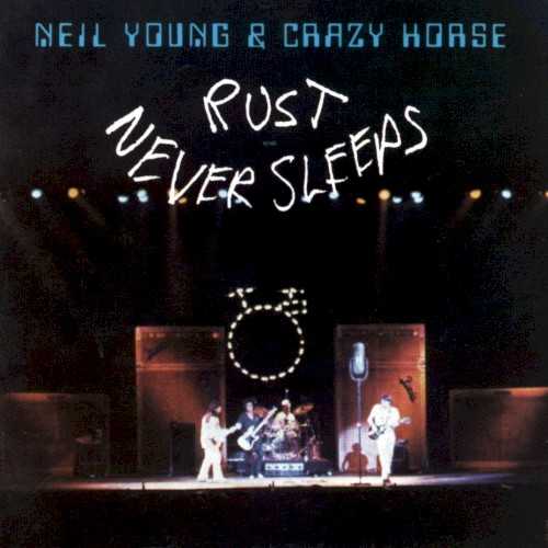 Allmusic album Review : Rust Never Sleeps, its aphoristic title drawn from an intended advertising slogan, was an album of new songs, some of them recorded on Neil Youngs 1978 concert tour. His strongest collection since Tonights the Night, its obvious antecedent was Bob Dylans Bringing It All Back Home, and, as Dylan did, Young divided his record into acoustic and electric sides while filling his songs with wildly imaginative imagery. The leadoff track, "My My, Hey Hey (Out of the Blue)" (repeated in an electric version at albums end as "Hey Hey, My My [Into the Black]" with slightly altered lyrics), is the most concise and knowing description of the entertainment industry ever written; it was followed by "Thrasher," which describes Youngs parallel artistic quest in an extended metaphor that also reflected the albums overall theme -- the inevitability of deterioration and the challenge of overcoming it. Young then spent the rest of the album demonstrating that his chief weapons against rusting were his imagination and his daring, creating an archetypal album that encapsulated his many styles on a single disc with great songs -- in particular the remarkable "Powderfinger" -- unlike any he had written before.