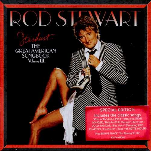 Allmusic album Review : If the cover of Stardust: The Great American Songbook, Vol. 3 is any indication, even Rod Stewart is getting a little tired of the classy act hes had to put on over the last two years, as hes restyled himself as a crooner of pop standards. Gone are the straightforward portrait shots, and in is a jokey picture of Rod with a pair of hot legs. It unwittingly looks like a grown-up variation of the Blondes Have More Fun cover taken 26 years later (Rod still has the same basic hairdo, bless his heart), and its a welcome glimpse of the roguish charm and laddish sense of humor that used to be Stewarts calling card. Unfortunately, that attitude isnt heard anywhere on the music, which is, for all intents and purposes, pretty much the same as it was on the first two installments of The Great American Songbook. Like its predecessors, Stardust is built on the misconception that the great vocalist Stewart will sound great singing selections from the great American popular songbook, when his gifts are better suited for music rooted in folk, blues, and rock & roll. To his credit, hes sounding a bit more comfortable on this third go-round -- he doesnt sound as uptight, nor as mannered, as he did before. Part of this may be due to a shift in producers. Phil Ramone, who co-produced the first two, has left and has been replaced by Steve Tyrell, who releases albums in a similar vein himself. Under his watch, Stewart doesnt sound quite so studious and tentative, and the arrangements arent quite so fussy, which ultimately makes for a better record. That isnt the same thing as a good record, though. Stewart may be more comfortable and the production might be warmer, but The Great American Songbook is still a bad idea, no matter how slickly its delivered.