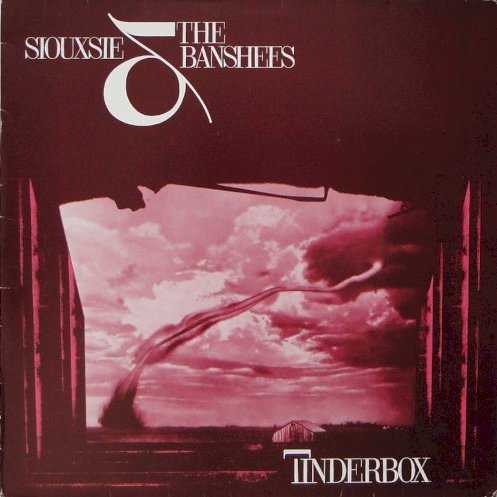 Allmusic album Review : Tinderbox is the most musically up-tempo of all Siouxsie and the Banshees albums and the most stylistically consistent one since The Scream and Join Hands. Most of the selections here feature urgently rocking drumming, drivingly aggressive yet fully textured guitar playing, and masterful, gutsy singing. The songs here are intense and unfold slowly, some starting off less vigorously but becoming hard rockers further along. There is of course a fine line between consistency and lack of contrast, but this album stays firmly on the side of the former; in fact, theres a certain satisfying feel to the musically uniform wall of sound here. The arrangements are less complex than in immediately preceding albums, but there are still plenty of subtle, effective production touches to be found throughout, most notably in the song "Cannons." "Cities in the Dust," a dance-pop number with a bell-like synthesizer opening section, stretches the above-mentioned boundaries the most, though typically bleak lyrics keep this selection from any sense of vacuity. This excellent release is well worth purchasing.