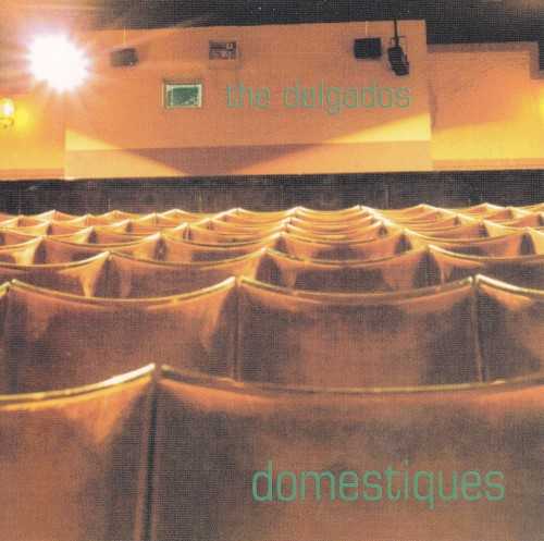 Allmusic album Review : Domestiques is the sound of the Delgados developing their songcraft. Everything is a bit more loose and jagged than on Peloton and The Great Eastern. Perhaps they hadnt yet mastered their instruments, or they were torn between the pop and punk aesthetics they would later straddle so masterfully. For the most part, the melodies and hooks arent as strong as later material; maybe the album is missing a certain bittersweet quality. Sonically, things are about on par with the later albums, but theres less harmonizing and less interplay between the two lead vocalists. The songs here are also a bit noisier and less focused than later songs. At the same time, there are certainly some great hooks in the mix. Even when things dont take off fully on the flights of fancy for which the band would become known, the songwriting is always first-rate. Its quite fun to hear the sped-up catchiness and angst of "Sucrose" and "Friendly Conventions," which suggest that the band was then thinking of going the route of Bis. The Delgados really did come out of the gate as expert songwriters on this debut album. The best signs of things to come are found in "Akumulator," "4th Channel," and "Under Canvas Under Wraps." Domestiques is a strong debut album from the Delgados; it blows pretty much every other album in the genre out of the water except, of course, Peloton and The Great Eastern. These 14 songs, getting in under the gun at 40 minutes, are the first giant steps from a band that would soon be leaping long before it looked, or so the cliché goes. It is quite easy to lose yourself in the catchy charms of any album by the Delgados; every band should be forced to study the Delgados discography before starting out.