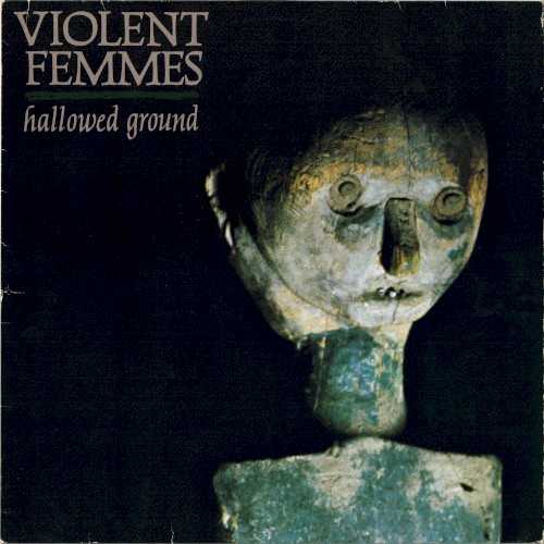 Allmusic album Review : After the surprise success of their landmark debut, Violent Femmes could have just released another collection of teen-rage punk songs disguised as folk, and coasted into the modern rock spotlight alongside contemporaries like the Modern Lovers and Talking Heads. Instead they made Hallowed Ground, a hellfire-and-brimstone-beaten exorcism that both enraged and enthralled critics and fans alike. Like Roger Waters purging himself of the memories of his fathers death through The Wall and The Final Cut, bandleader Gordon Gano uses the record to expel his love/hate relationship with religion, and the results are alternately breathtaking and terrifying. Contrary to initial public response, Hallowed Ground is not a parody. Gano, the son of a Baptist minister, may wear his faith like a badge of honor, but its a badge, not a shield, and what keeps the songs so volatile is the fact that theyre filtered through the eyes, ears, heart, and loins of a teenager. Like the first record, all of the songs on Hallowed Ground were written during Ganos high-school years -- he was barely in his twenties when it was released -- resulting in a perfect rendering of the sweetness and brutality of the postpubescent teen, especially on the albums centerpiece; a searing indictment of loyalties broken and the snitches that break them, "Never Tell" is the perfect balm for the bloody righteousness of youth, and when Gano screams, "Ill stand right up in the heart of Hell/I never tell," its hard not to stand right beside him. Christian imagery aside, Hallowed Ground is not as polarizing as some make it out to be. The band explores gothic Appalachian folk and child murder on the banjo-fueled "Country Death Song," bawdy and bluesy Lou Reed-inflected infatuation on "Sweet Misery Blues," and nuclear holocaust on the brooding title track, leaving little doubt that this is the same band that penned underground classics like "Gone Daddy Gone" and "Add It Up." Even the decidedly politically uncorrect "Black Girls," with its free jazz mid-section that includes everything from jaw harp to the screaming alto sax of John Zorn and the Horns of Dilemma, is full of the same smirk and swagger that made "Blister in the Sun" the soundtrack to so many peoples halcyon days. The Femmes are nothing if not true to themselves, and Hallowed Ground is a testament to their tenacity, courage, and sheer obliviousness to industry ogling. Each track is as naked as it is bursting with ideas, and as the landscape changes, the band changes with it, leaving the listener at a crossroads; with each incantation, growling invective, and honey-whispered promise, theyre forced to either jump off the gospel train or ride it along with them into the mouth of Hell.