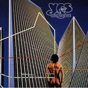 Allmusic album Review : Going for the One is perhaps the most overlooked item in the Yes catalog. It marked Rick Wakemans return to the band after a three-year absence, and also a return to shorter song forms after the experimentalism of Close to the Edge, Tales from Topographic Oceans, and Relayer. In many ways, this disc could be seen as the follow-up to Fragile. Its five tracks still retain mystical, abstract lyrical images, and the music is grand and melodic, the vocal harmonies perfectly balanced by the stinging guitar work of Steve Howe, Wakemans keyboards, and the solid rhythms of Alan White and Chris Squire. The title track features Howe on steel guitar (hes the only prog rocker who bothers with the instrument). "Turn of the Century" and the albums single, "Wonderous Stories," are lovely ballads the way only Yes can do them. "Parallels" is the albums big, pompous song, so well done that in later years the band opened concerts with it. Wakemans stately church organ, recorded at St. Martins Church, Vevey, Switzerland, sets the tone for this "Roundabout"-ish track. The concluding "Awaken" is the albums nod to the extended suite. Again, the lyrics are spacy in the extreme, but Jon Anderson and Squire are dead-on vocally, and the addition of Andersons harp and Whites tuned percussion round out this evocative track.